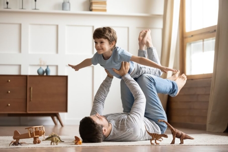 Father holding child in the air